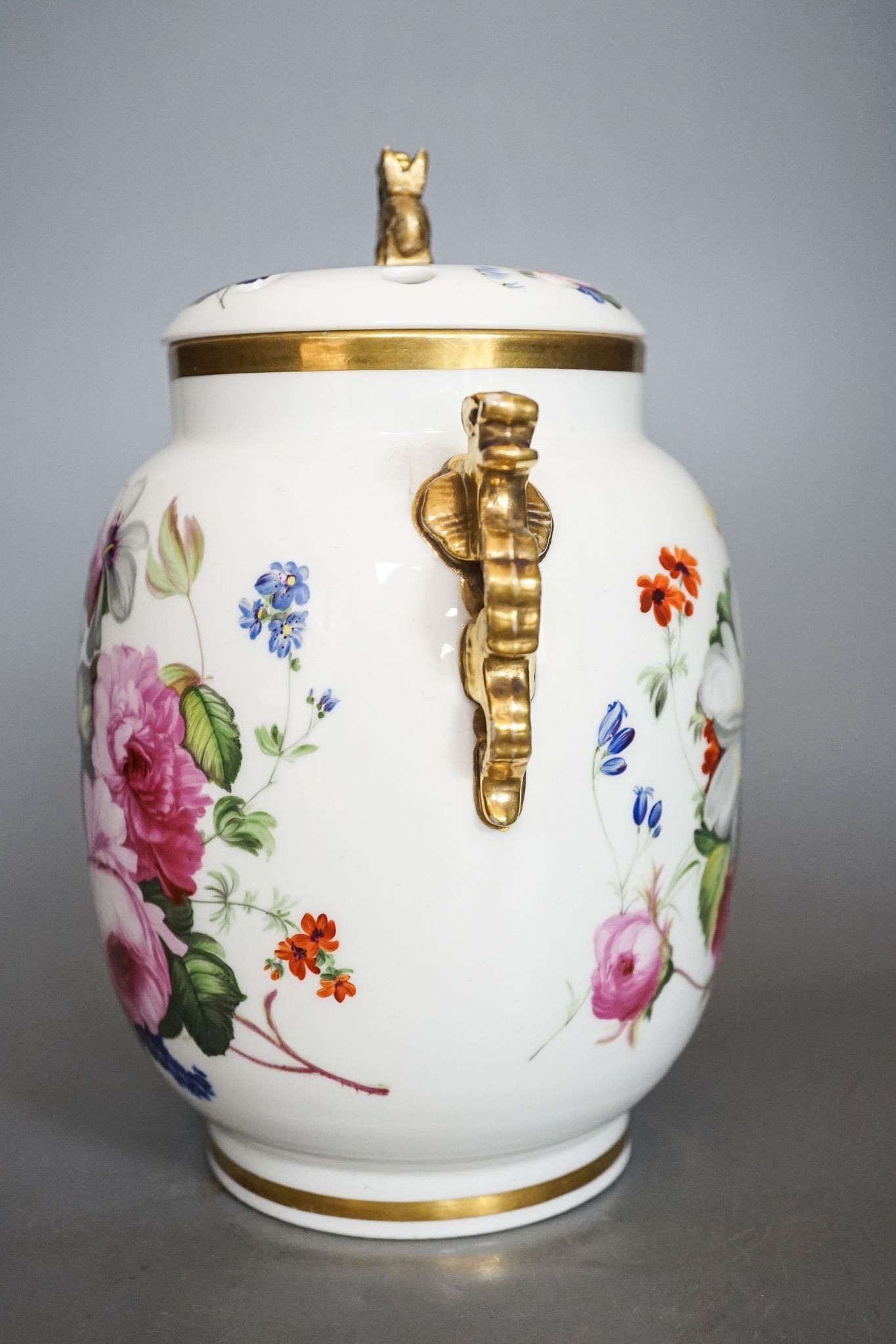 An English porcelain pot pourri vase, cover and inner cover, probably Coalport, painted with roses and flowers 21cm